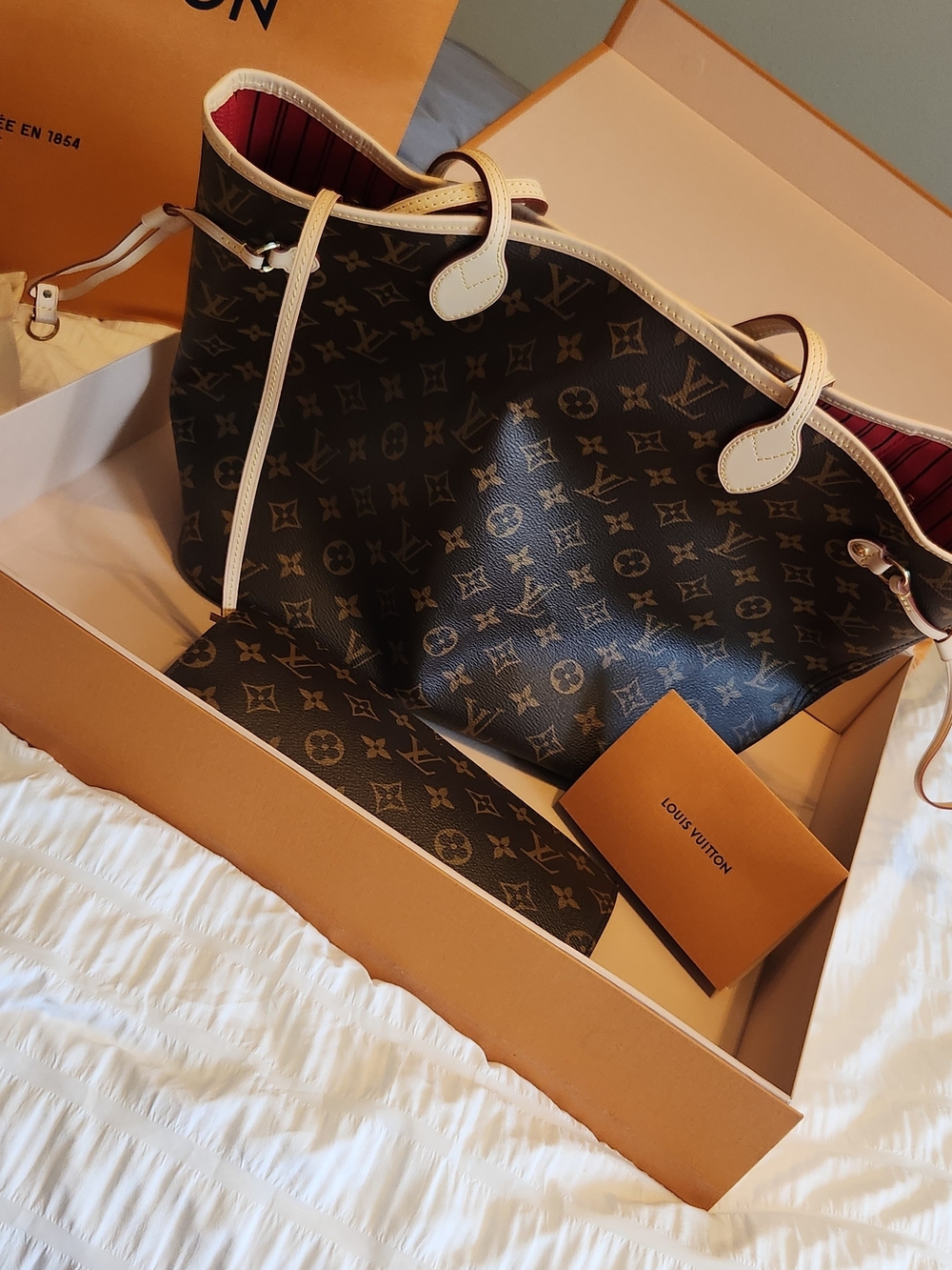 Louis Vuitton Monogram Canvas Tote with Cream Trim and Red Interior: Neverfull